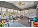 Bright sunroom with ample seating and natural light at 36645 Kay Ave, Zephyrhills, FL 33542