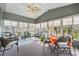 Cozy sunroom with lots of natural light and comfortable seating at 36645 Kay Ave, Zephyrhills, FL 33542