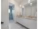 Bright bathroom with double sink vanity and sleek glass shower at 4110 W Swann Ave, Tampa, FL 33609