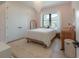 Cozy bedroom with pink walls, plush rug, and ample natural light from the window at 4110 W Swann Ave, Tampa, FL 33609