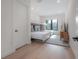 Bright bedroom features hardwood floors, bunk beds, and natural light streaming through the window at 4110 W Swann Ave, Tampa, FL 33609