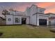 Stunning modern home boasting clean lines, a two-car garage, and lush green landscaping at 4110 W Swann Ave, Tampa, FL 33609