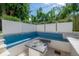 Cozy fire pit area with built-in seating, perfect for outdoor gatherings and relaxation at 4110 W Swann Ave, Tampa, FL 33609