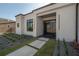 Modern home exterior featuring manicured landscaping, clean lines, and a welcoming entrance at 4110 W Swann Ave, Tampa, FL 33609