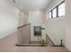 Bright hallway with modern railings and staircase leading to the upper level at 4110 W Swann Ave, Tampa, FL 33609