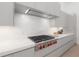 Modern kitchen with high-end stainless steel appliances, sleek cabinetry, and a marble backsplash at 4110 W Swann Ave, Tampa, FL 33609