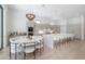 Modern kitchen with sleek cabinetry, a spacious island with bar seating, and stylish lighting fixtures at 4110 W Swann Ave, Tampa, FL 33609