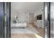 A bright main bedroom features a modern decor, with a view of the backyard at 4110 W Swann Ave, Tampa, FL 33609