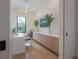 Bright office featuring a modern desk, built-in storage, and a large window at 4110 W Swann Ave, Tampa, FL 33609
