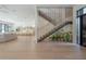 Bright, open floor plan featuring a modern staircase, living area, and a gourmet kitchen at 4110 W Swann Ave, Tampa, FL 33609
