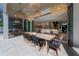 A seamless indoor-outdoor space with dining area, outdoor kitchen, and modern decor at 4110 W Swann Ave, Tampa, FL 33609