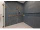 Close-up of the stunning shower featuring subway tile, rainfall showerhead, and gold fixtures at 4110 W Swann Ave, Tampa, FL 33609