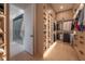 Spacious walk-in closet featuring custom shelving and ample hanging space at 4110 W Swann Ave, Tampa, FL 33609