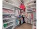 Walk-in closet with organized shelving, hanging rods, and plenty of storage space at 4110 W Swann Ave, Tampa, FL 33609