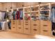 Custom walk-in closet featuring built-in shelving, drawers, and ample storage space at 4110 W Swann Ave, Tampa, FL 33609