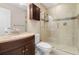 Bathroom with a tiled walk-in shower and a dark wood vanity with a light countertop at 4215 E Bay Dr # 1601D, Clearwater, FL 33764