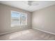 Carpeted bedroom with a ceiling fan and window with white plantation shutters at 4215 E Bay Dr # 1601D, Clearwater, FL 33764