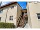Exterior view of the two-story condo building featuring a staircase to multiple units at 4215 E Bay Dr # 1601D, Clearwater, FL 33764
