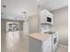 Bright open living room with ceramic tile floors and sliding glass doors to private outdoor balcony at 4215 E Bay Dr # 1601D, Clearwater, FL 33764