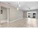 Spacious open-concept living room featuring tiled floors and sliding glass doors to the outdoor balcony at 4215 E Bay Dr # 1601D, Clearwater, FL 33764