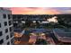 Aerial view of a waterfront community at sunset, showcasing the beautiful homes and canals at 4400 37Th S St # 3, St Petersburg, FL 33711