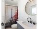 Bright bathroom features a vessel sink and a shower with an Eiffel Tower themed shower curtain at 4400 37Th S St # 3, St Petersburg, FL 33711