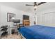 This bedroom features a ceiling fan, hardwood floors, and a spacious walk-in closet at 4400 37Th S St # 3, St Petersburg, FL 33711
