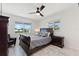 Bedroom with a ceiling fan, marble floors and natural light from the windows at 4400 37Th S St # 3, St Petersburg, FL 33711