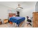 This bright bedroom includes a ceiling fan, hardwood floors, and a comfortable workspace at 4400 37Th S St # 3, St Petersburg, FL 33711