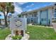 Beautiful condo exterior shows well-maintained lawn and clean facade at Maximo Harbour Condominiums at 4400 37Th S St # 3, St Petersburg, FL 33711