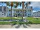 This building features a well-manicured lawn with lovely palm trees in front of the condominiums at 4400 37Th S St # 3, St Petersburg, FL 33711