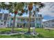 Building facade shows an exterior with pristine landscaping and shade trees at 4400 37Th S St # 3, St Petersburg, FL 33711