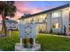 Well-manicured condos feature lush landscaping and an inviting sign at Maximo Harbour Condominiums at 4400 37Th S St # 3, St Petersburg, FL 33711