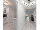 Bright condo foyer with modern light fixtures and marble tiled flooring throughout at 4400 37Th S St # 3, St Petersburg, FL 33711