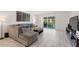 Comfortable living room with sliding glass doors that lead to an outdoor balcony at 4400 37Th S St # 3, St Petersburg, FL 33711