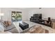 Comfortable living room with sliding glass doors that lead to an outdoor balcony at 4400 37Th S St # 3, St Petersburg, FL 33711