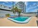 Outdoor pool area with lounge chairs and palm trees at 4400 37Th S St # 3, St Petersburg, FL 33711