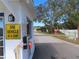 Community entrance featuring a guard house and gate, ensuring privacy and security for residents in this gated neighborhood at 4845 Baker Ave, Zephyrhills, FL 33541
