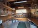 Spacious shed with workbench, shelving, and ample storage space for tools and projects at 4845 Baker Ave, Zephyrhills, FL 33541