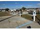 Community shuffleboard courts with seating offering residents opportunities for recreation and leisure in a park-like setting at 4845 Baker Ave, Zephyrhills, FL 33541
