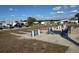 A shuffleboard court features seating, creating a place for friendly competition and relaxation in this vibrant community at 4845 Baker Ave, Zephyrhills, FL 33541