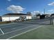 Enjoy an active lifestyle with a tennis court amenity featuring benches and seating, great for residents in this community at 4845 Baker Ave, Zephyrhills, FL 33541