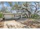 Inviting single-story home with a paved driveway and established landscaping at 4928 Petunia Ct, New Port Richey, FL 34652