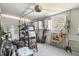 Cluttered garage interior view with storage and exercise equipment at 4928 Petunia Ct, New Port Richey, FL 34652