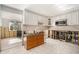 Bright kitchen with white cabinets, tile backsplash, and exposed framing at 4928 Petunia Ct, New Port Richey, FL 34652