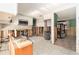 Spacious kitchen showcasing white cabinets, tile flooring, and the potential for a modern design at 4928 Petunia Ct, New Port Richey, FL 34652