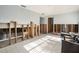 Bright living area featuring tile floors, exposed framing and access to multiple rooms at 4928 Petunia Ct, New Port Richey, FL 34652