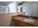 Bathroom featuring granite countertops, vanity and mirror at 5011 Glenburne Dr, Spring Hill, FL 34609