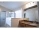 Bright bathroom featuring double vanity, granite counters, garden tub, and a glass enclosed shower at 5011 Glenburne Dr, Spring Hill, FL 34609