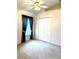 Bedroom featuring neutral carpet, high ceilings, and a ceiling fan at 5011 Glenburne Dr, Spring Hill, FL 34609